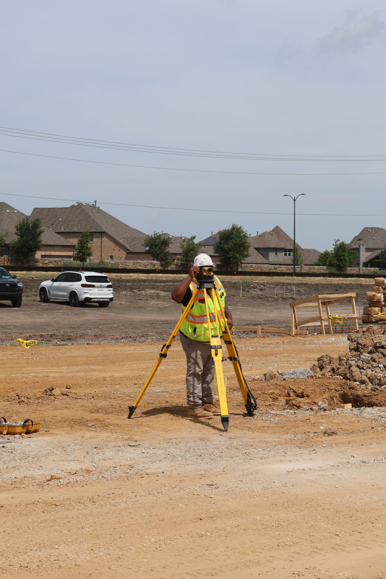 3D2A0527 Road Construction man measuring the distance and level of road.